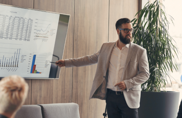 man giving presentation in suit blazer