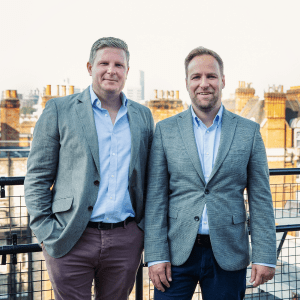 Two men standing on standing on balcony