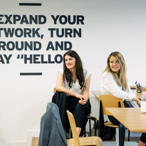 Two female colleagues smiling